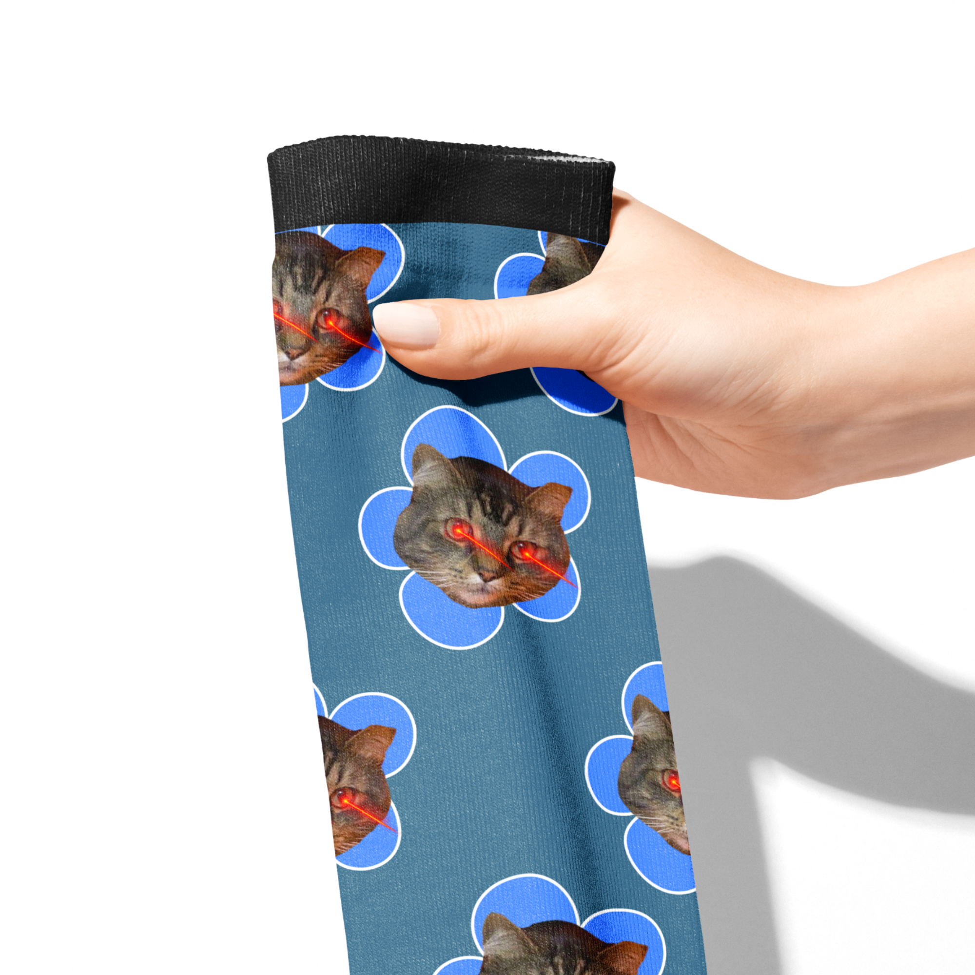 Custom Flower Socks featuring blue flower patterns with laser-eyed cat faces on a blue background held by a hand