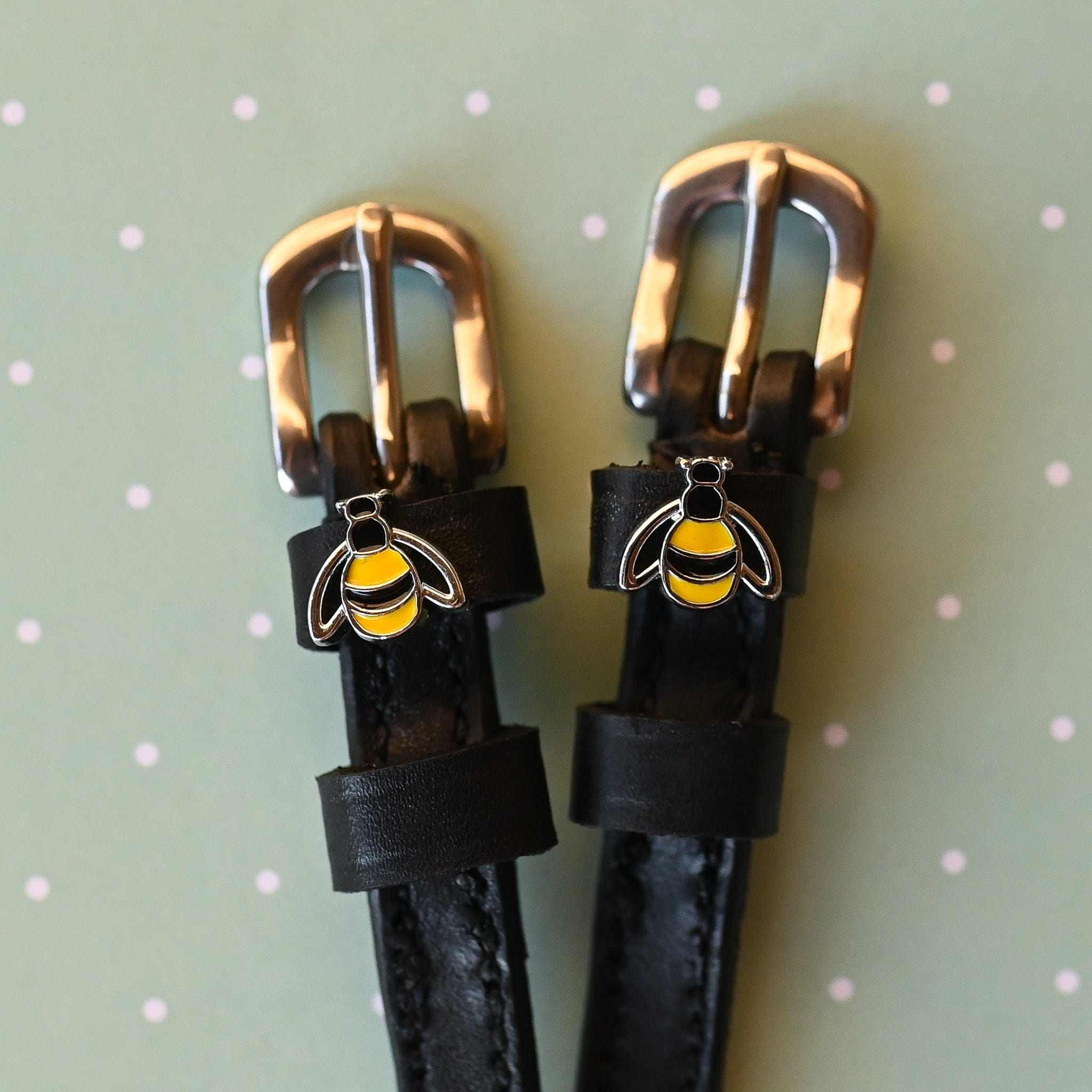 Bee Spur Straps ManeJane black leather spur straps with non-stretch interior and stainless steel buckle for English riding.