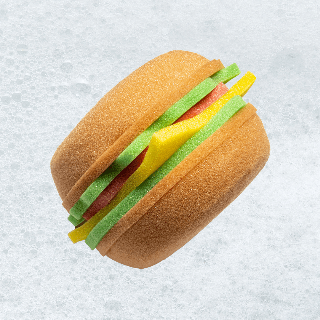 Burger-shaped bath sponge from Burger & Fries Bundle on bubbly water background
