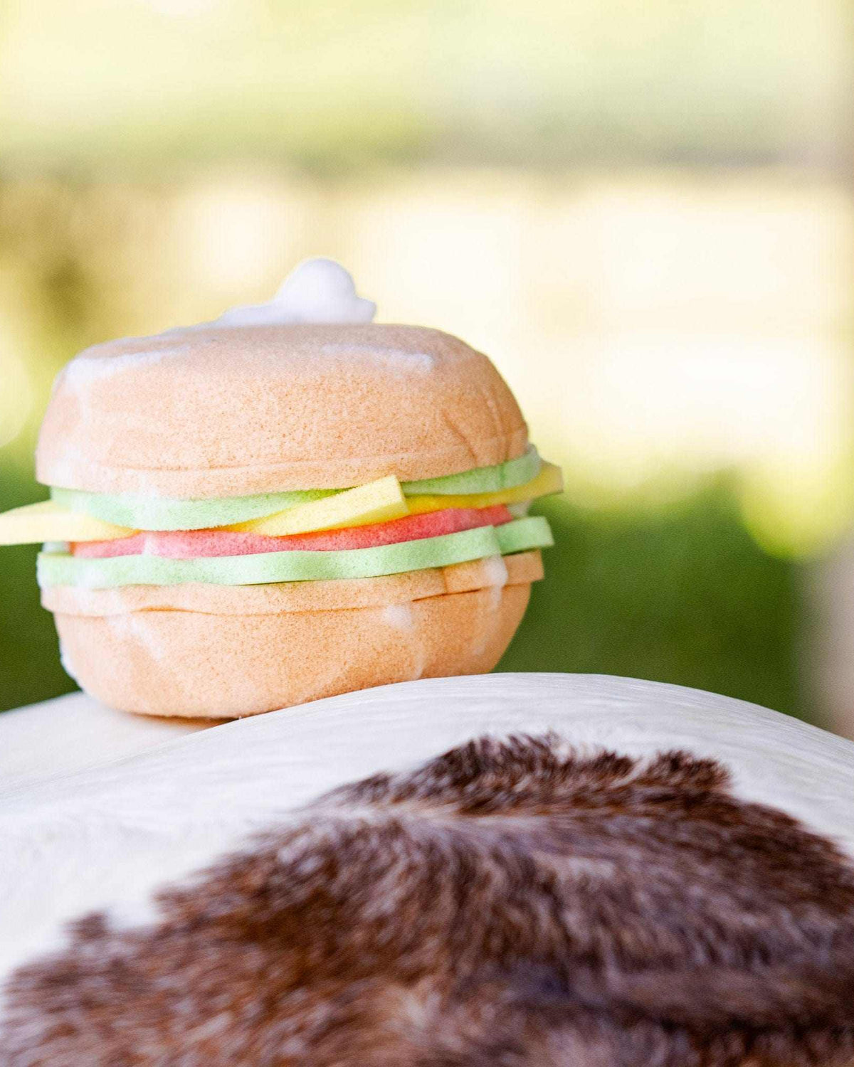 Burger-shaped bath sponge from the Burger & Fries Bundle for equestrian grooming and barn fun