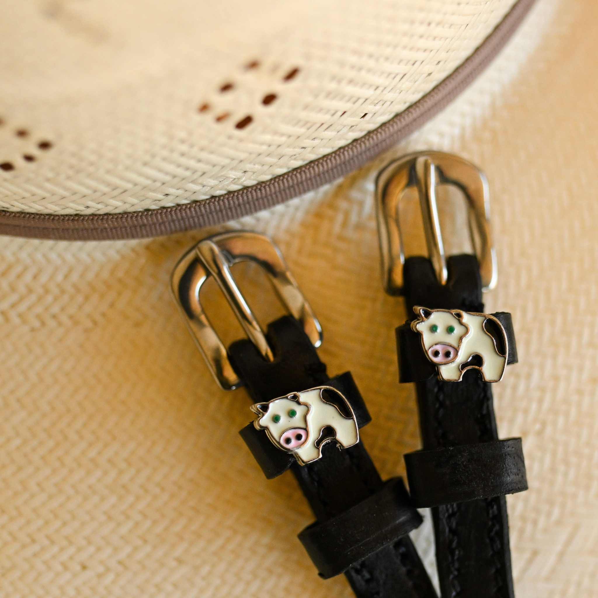 ManeJane Cow Spur Straps Spur Straps — black leather, non-stretch, hero image for English riders.