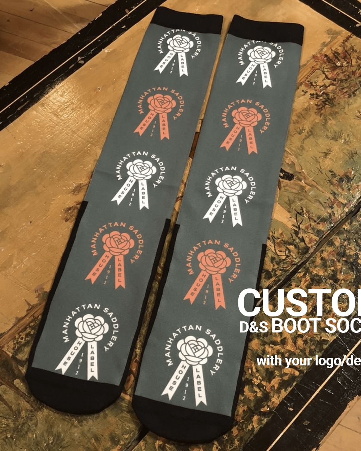 Custom D&S Riding Boot Socks with personalized Manhattan Saddlery logo design on gray background