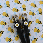 ManeJane Daisy Flower Spur Straps Spur Straps — black leather, non-stretch, hero image for English riders.