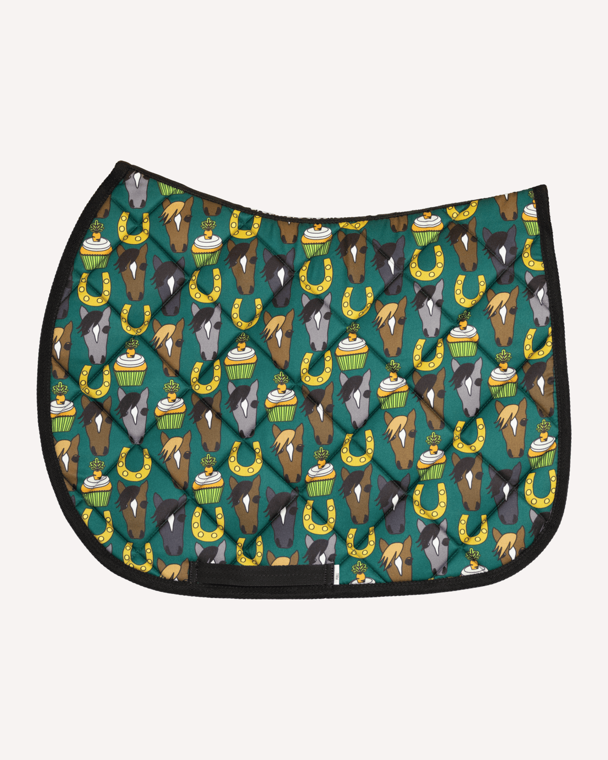 Carrot Cake saddle pad in teal with horse faces, cupcakes and horseshoes, English pad shown flat by Dreamers & Schemers