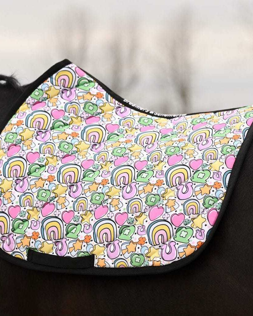 Lucky Equestrian Bundle colorful Full O’ Luck saddle pad with rainbows, hearts, and clovers on horse's back