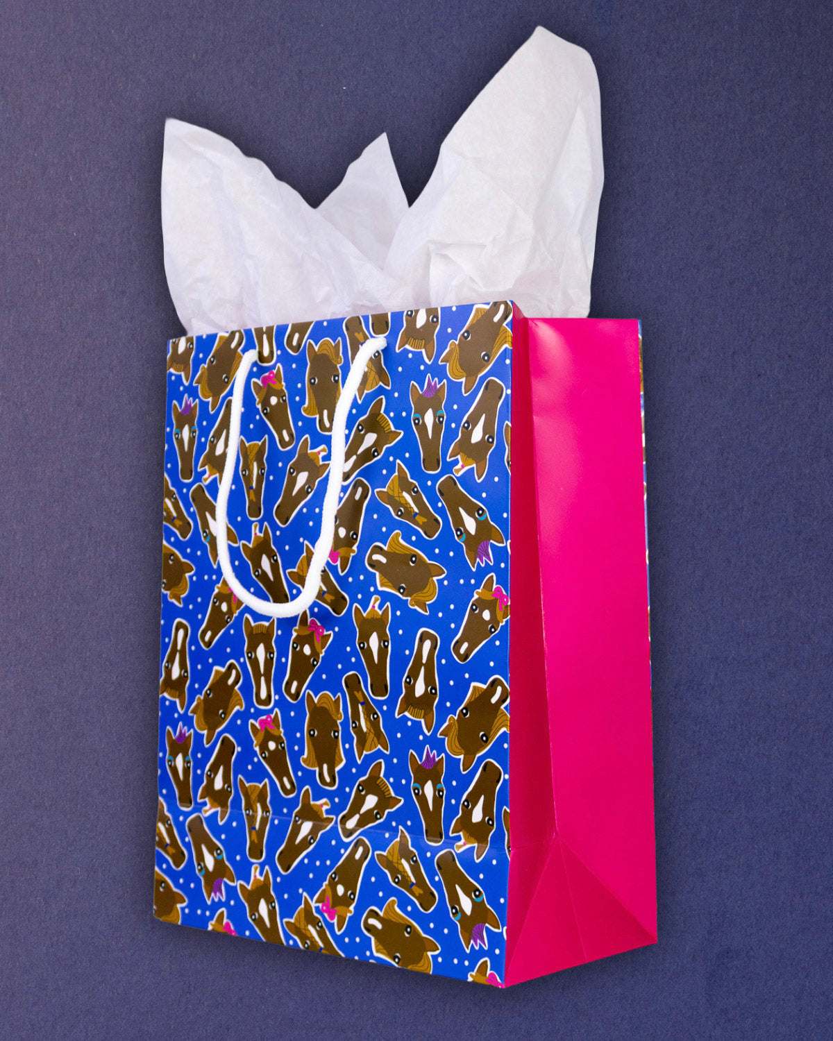 Hairy Styles medium gift bag angled right, blue front panel meeting the hot pink side gusset.