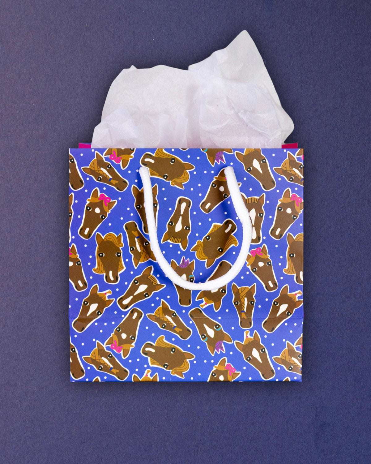 Hairy Styles small gift bag front-on without a tag, blue print of braided and bowed pony faces.