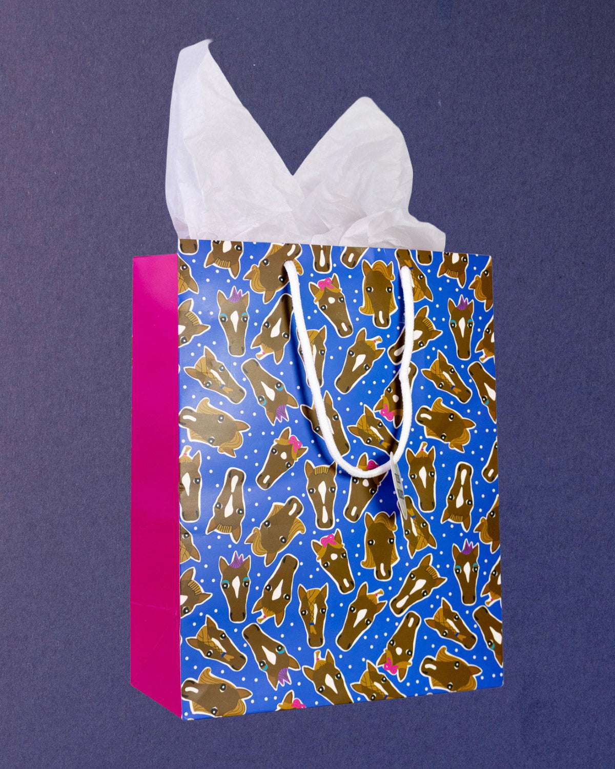Hairy Styles medium gift bag angled to show the hot pink side gusset at left beside the blue front.