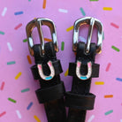 Horse Shoe Party Spur Straps ManeJane black leather spur straps with non-stretch interior and stainless steel buckle for En.