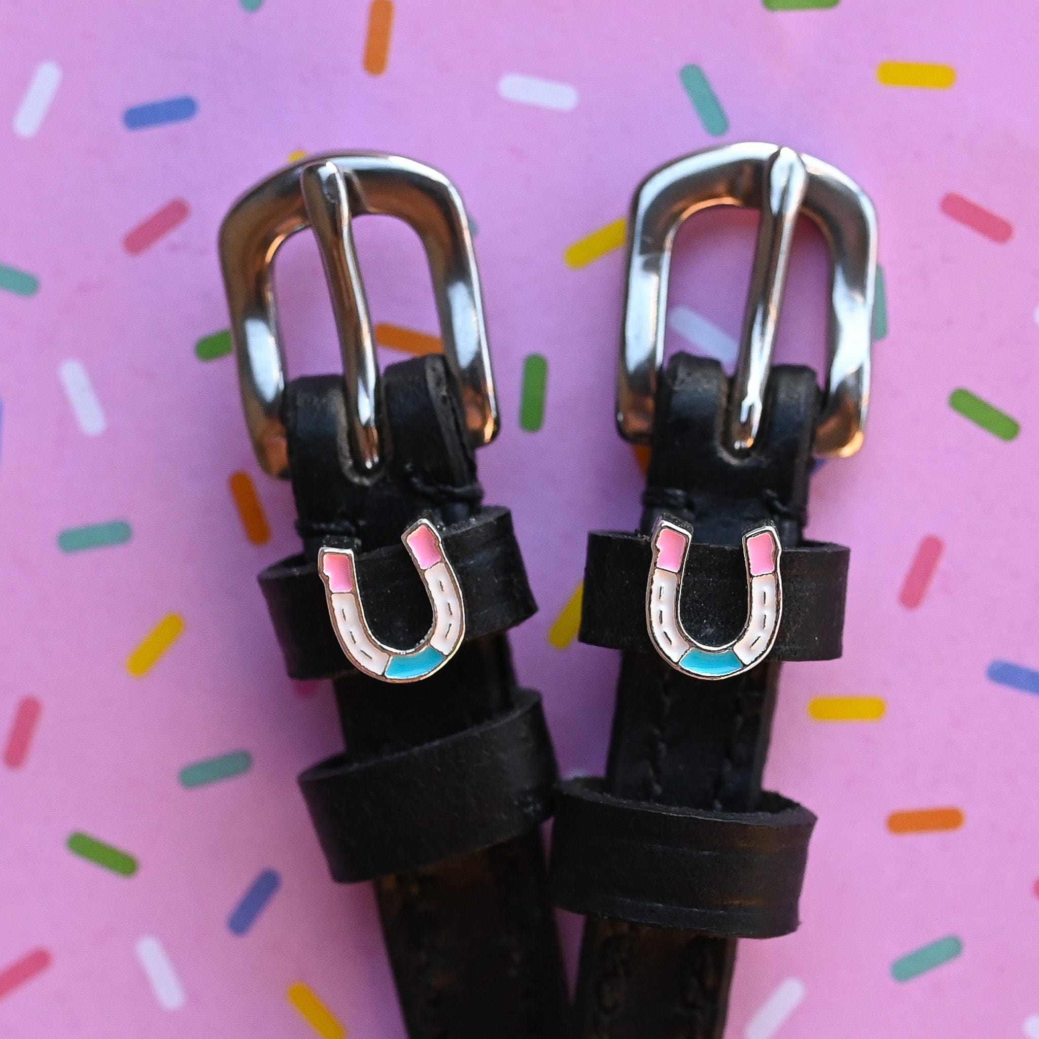 Horse Shoe Party Spur Straps ManeJane black leather spur straps with non-stretch interior and stainless steel buckle for En.