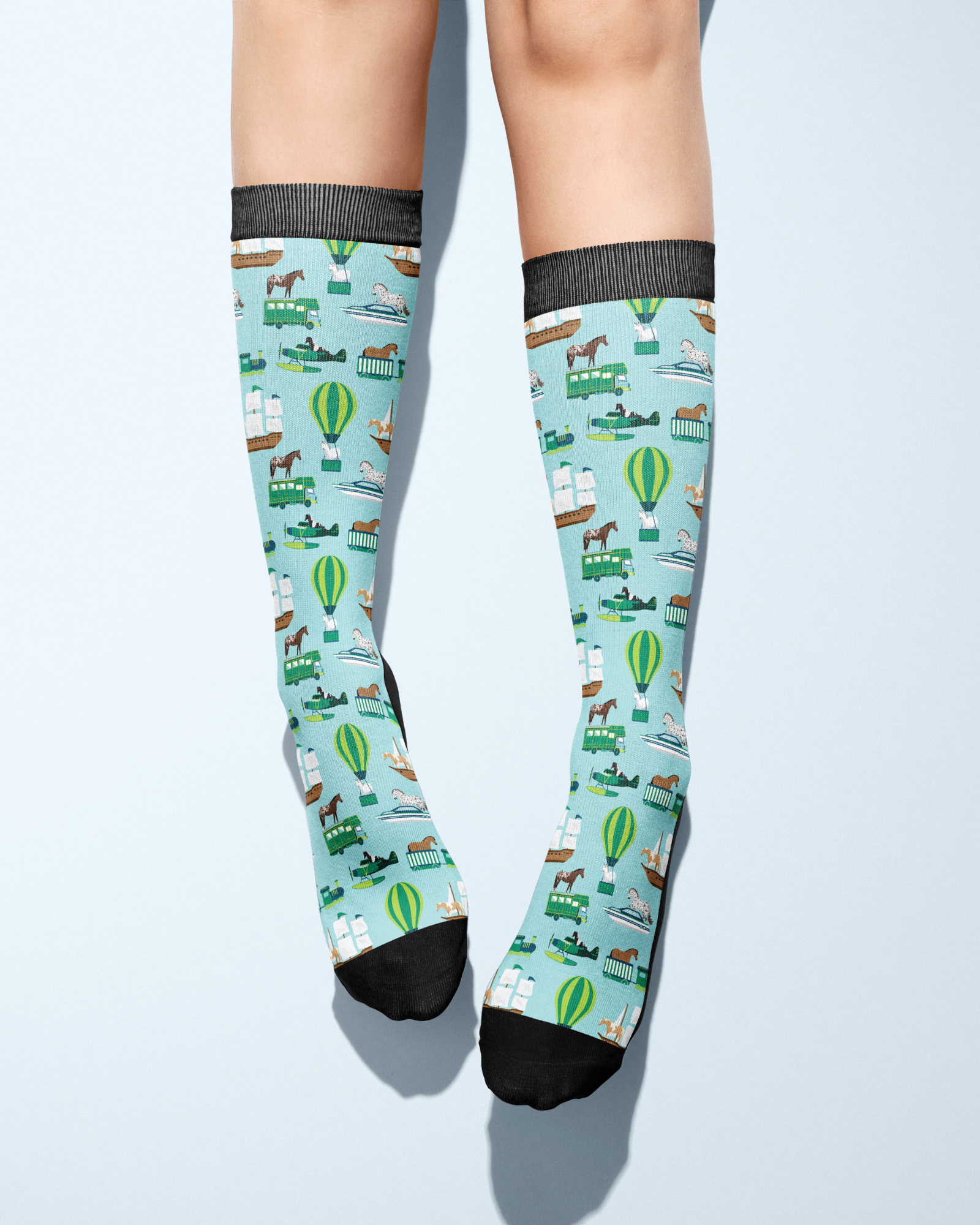 Limited Edition Pony Island Pony Transport Socks with cheerful ponies and adventure-themed design on light blue background