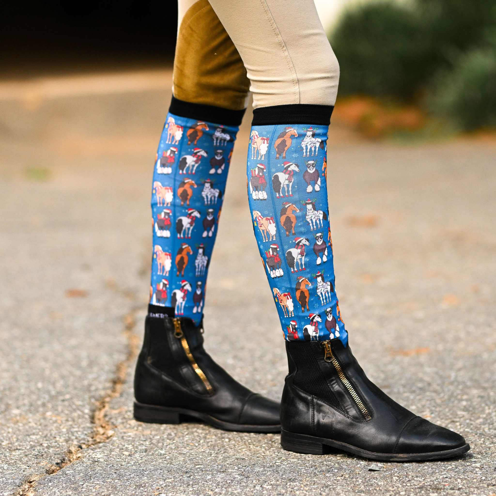 Blue boot socks with horse and peace sign pattern, flat seam toe and terry foot bottom for riding boots