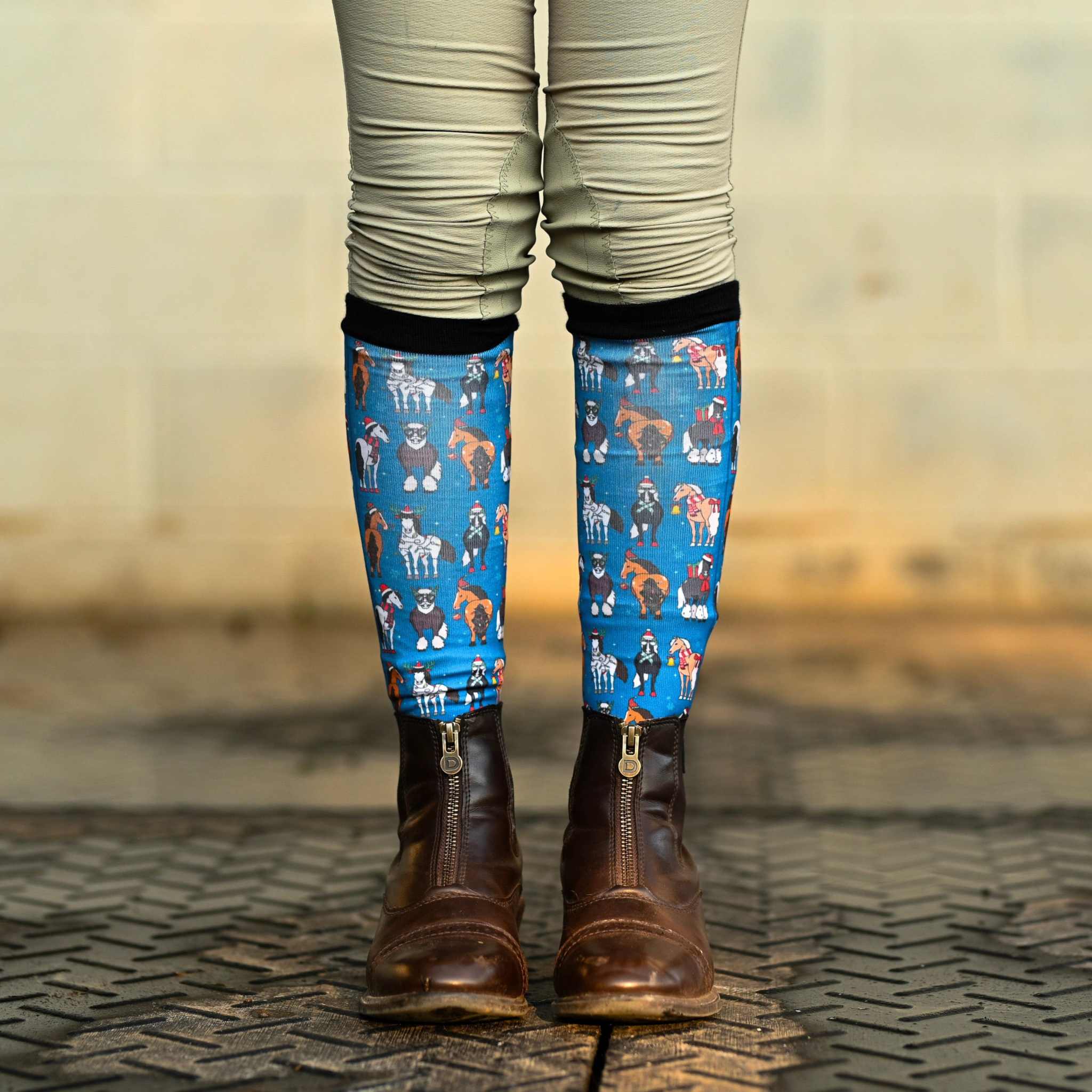 Youth riding boot socks with colorful dog pattern and black top band