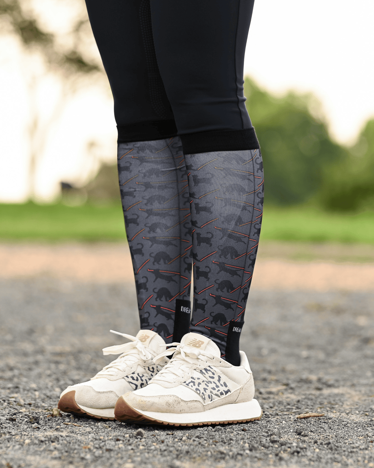 Laser Cats Pair & a Spare boot socks worn on the calf, charcoal with black cats firing red laser beams