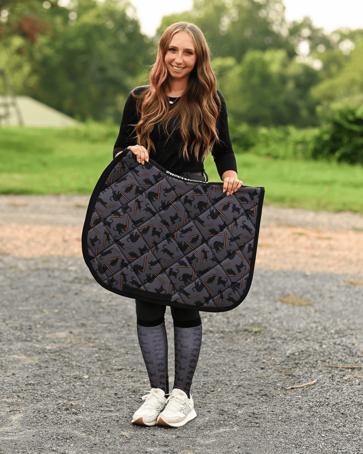 Laser Cats saddle pad carried at the barn, charcoal quilting printed with black cats firing red laser beams