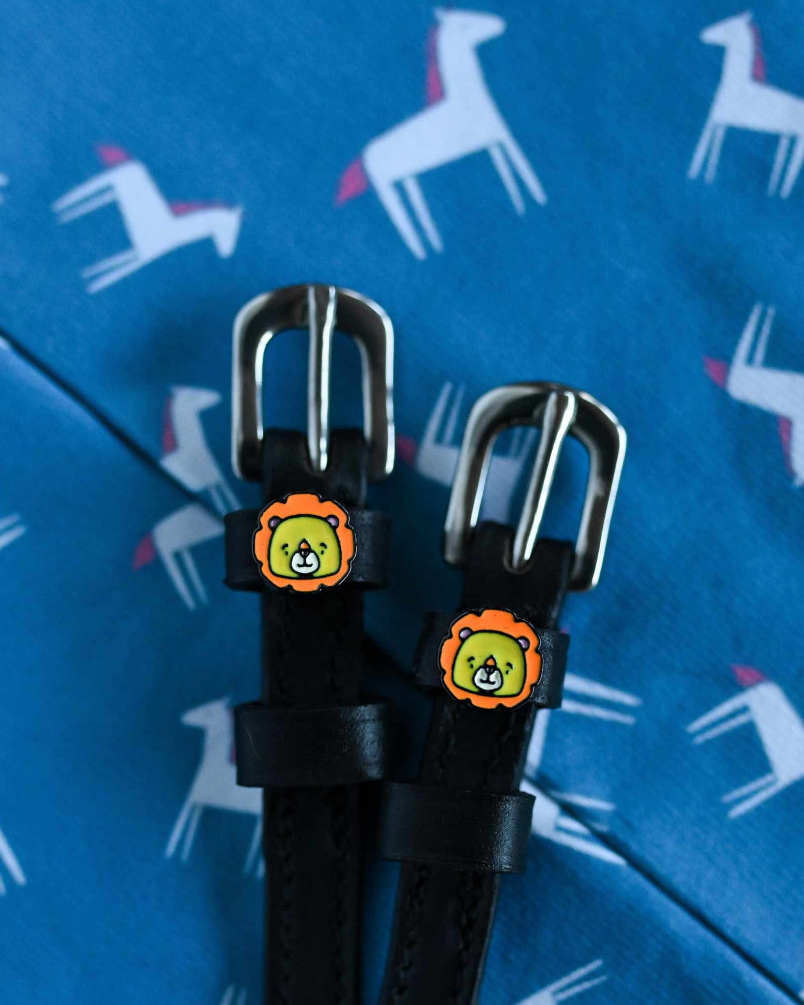 Lion Spur Straps ManeJane black leather spur straps with non-stretch interior and stainless steel buckle for English riding.