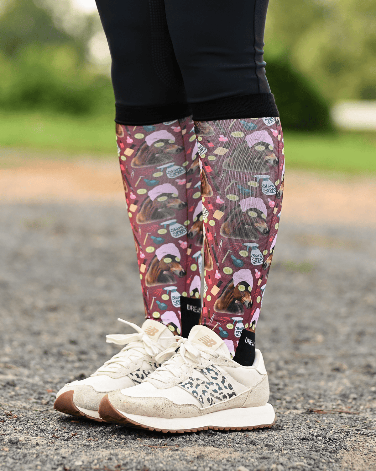 Mani Pedi riding boot socks styled over breeches, deep maroon with horses in spa turbans and cucumber slices