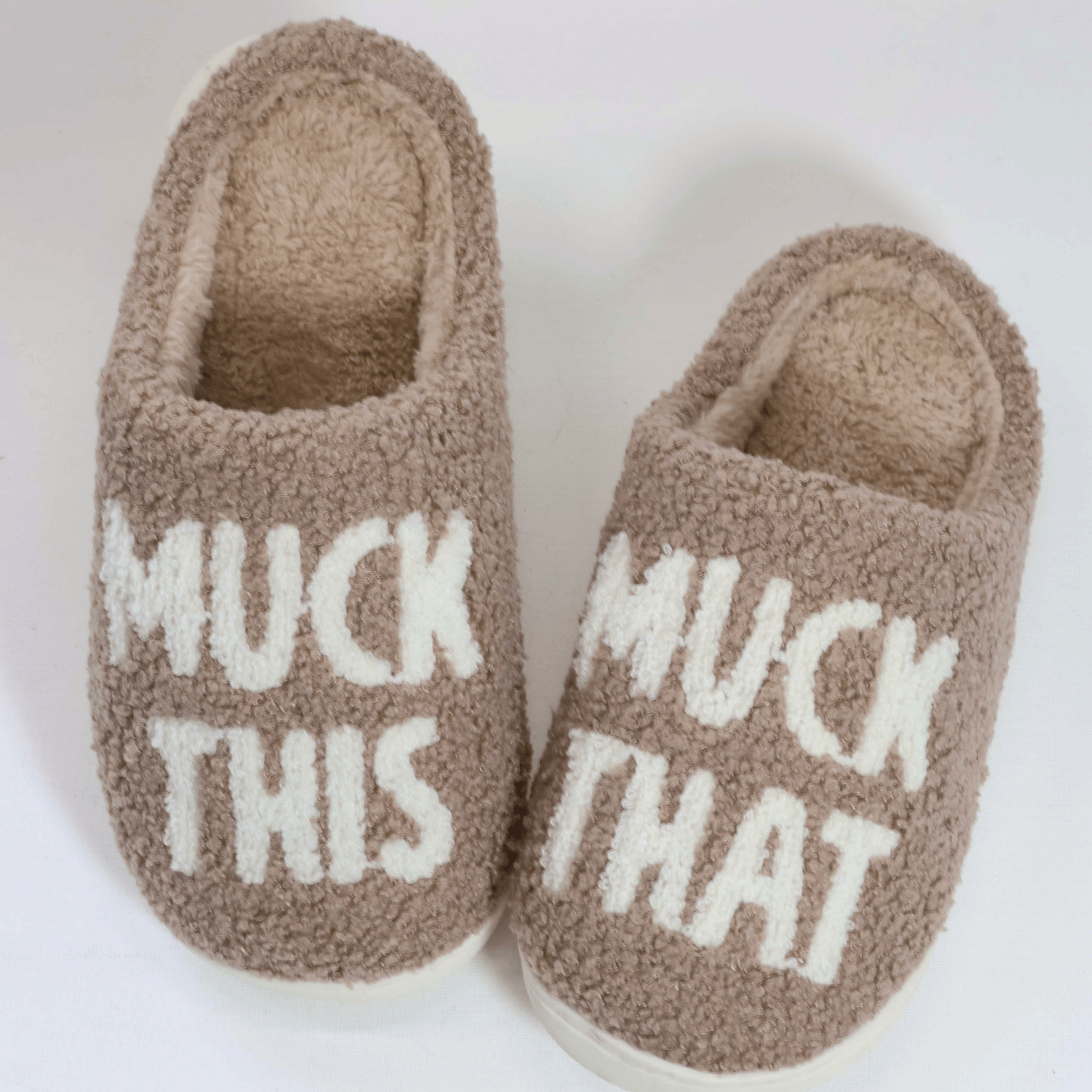Cozy brown slippers with "MUCK THIS" and "MUCK THAT" text, part of the Muck This Equestrian Bundle