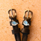 Narwhal Spur Straps ManeJane black leather spur straps with non-stretch interior and stainless steel buckle for English rid.