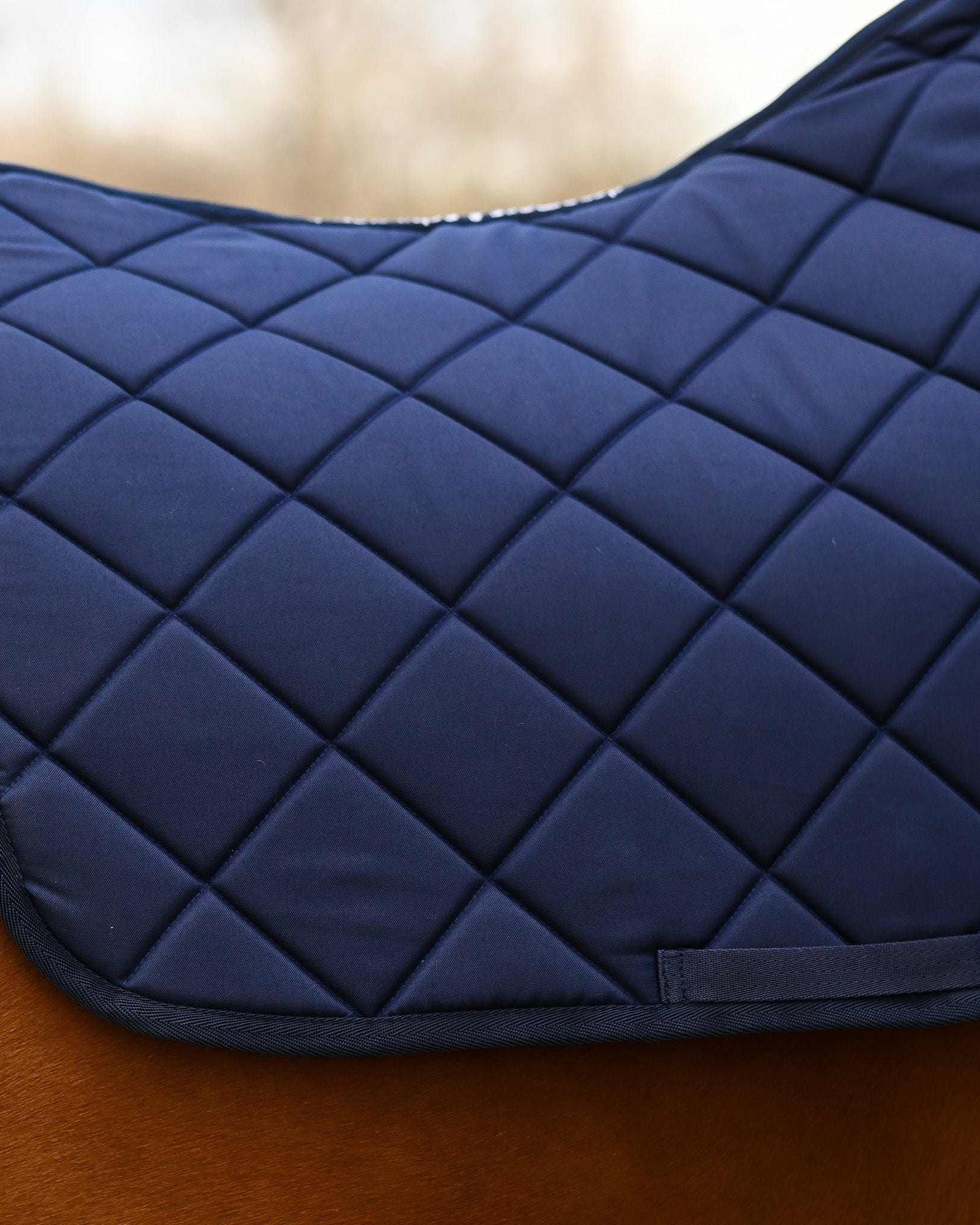 Navy Blue all-purpose saddle pad, showing the full pattern layout, by Dreamers & Schemers