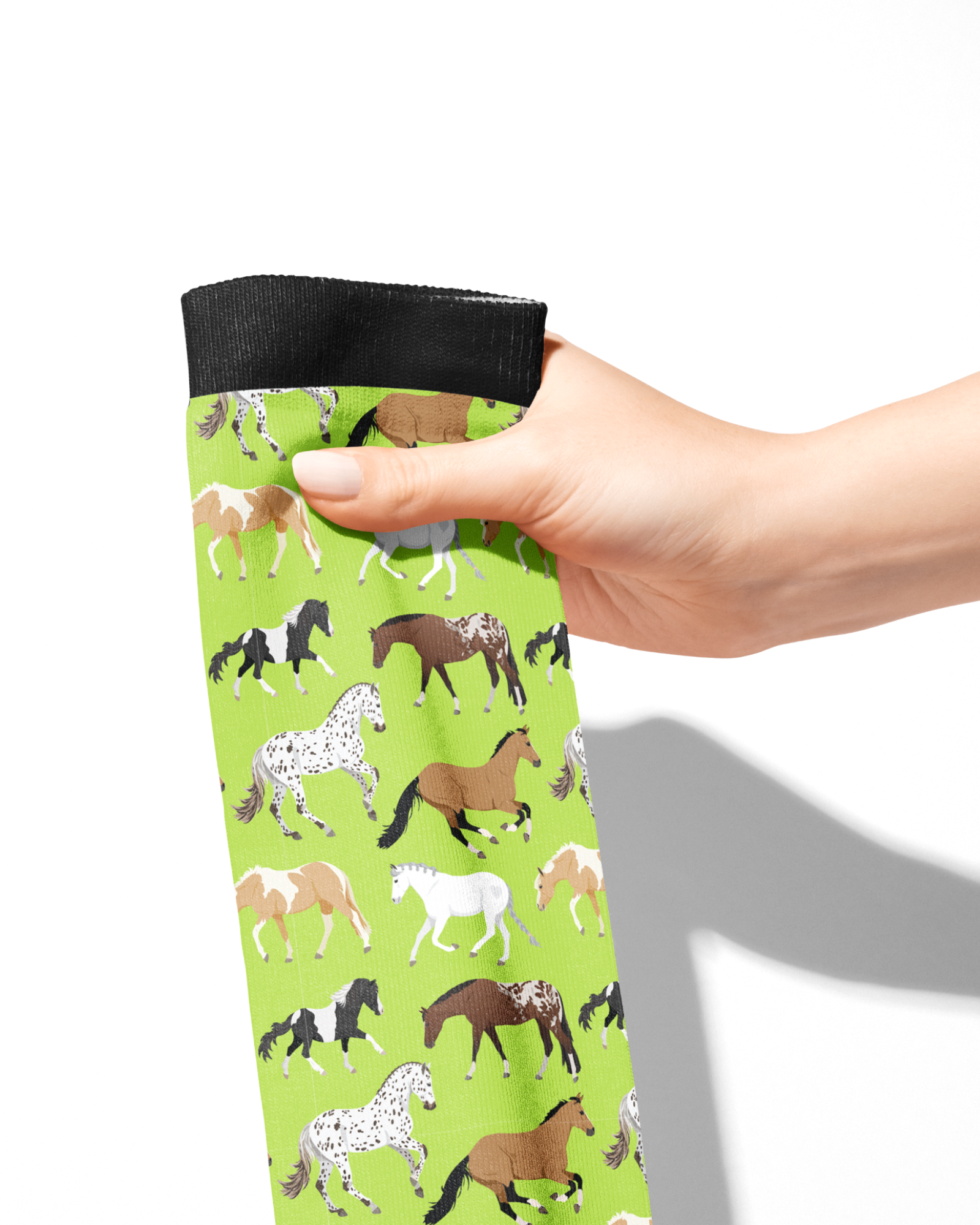 Limited Edition Pony Island Neon Ponies Socks with colorful horse pattern on green background, held in hand