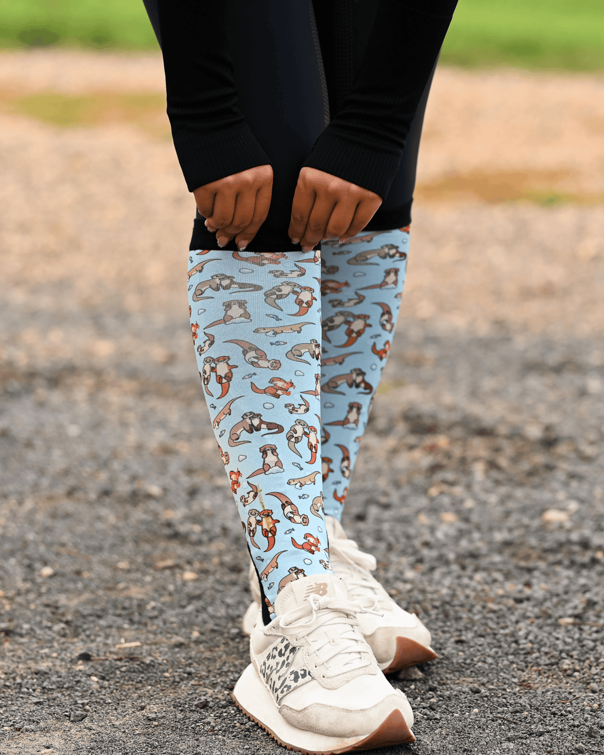 Otter-ly Adorable Pair & a Spare boot socks worn on the calf, pale blue with otters floating and holding hands