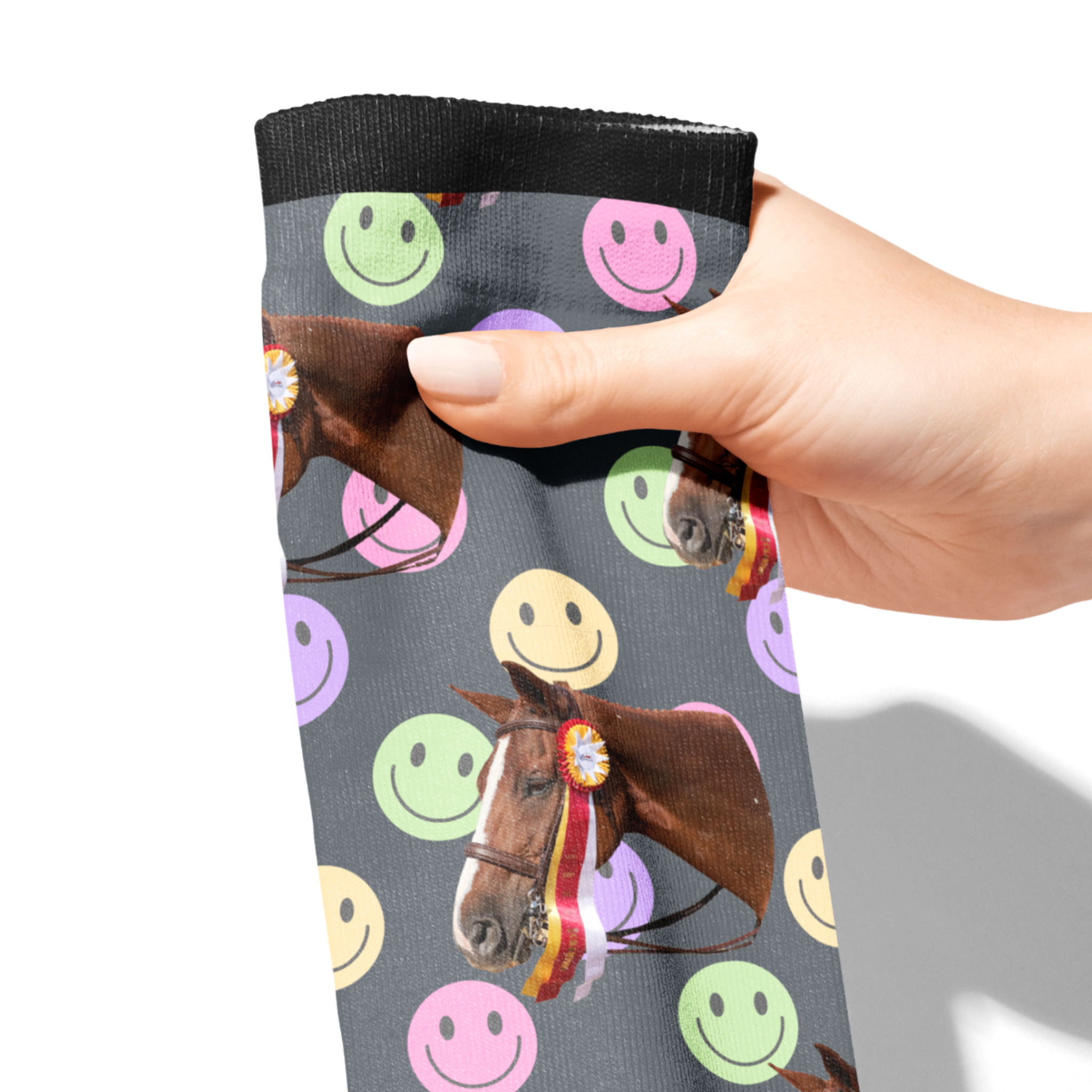 Hand holding custom solo socks with horse photo and colorful smiley faces pattern