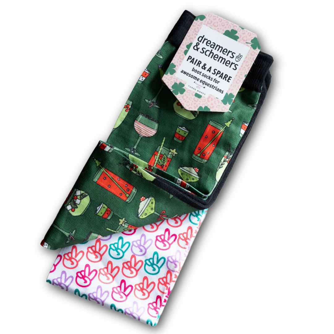 Pair of colorful boot socks with holiday-themed and peace sign patterns, designed for comfort and durability