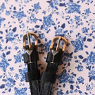 ManeJane Silver Martini Glass with Olive Spur Straps Spur Straps — black leather, non-stretch, hero image for English rider.