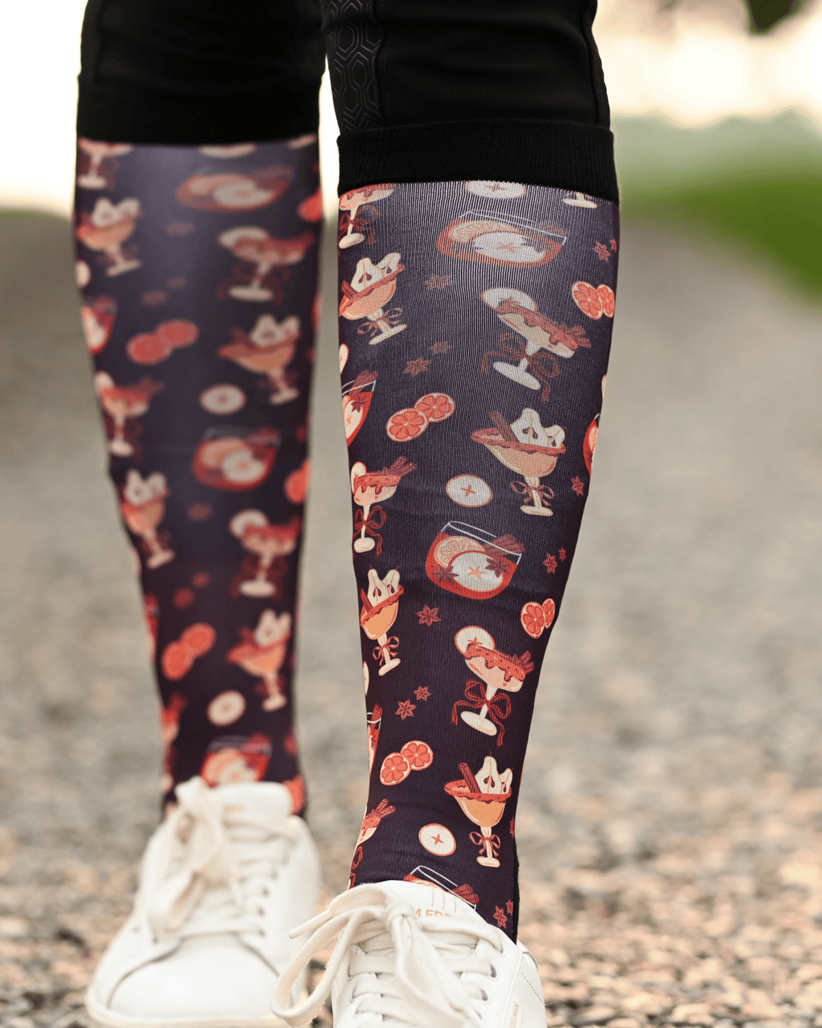 Stir Crazy Pair & a Spare boot socks worn on the calf, dark plum with cocktail glasses and citrus slices