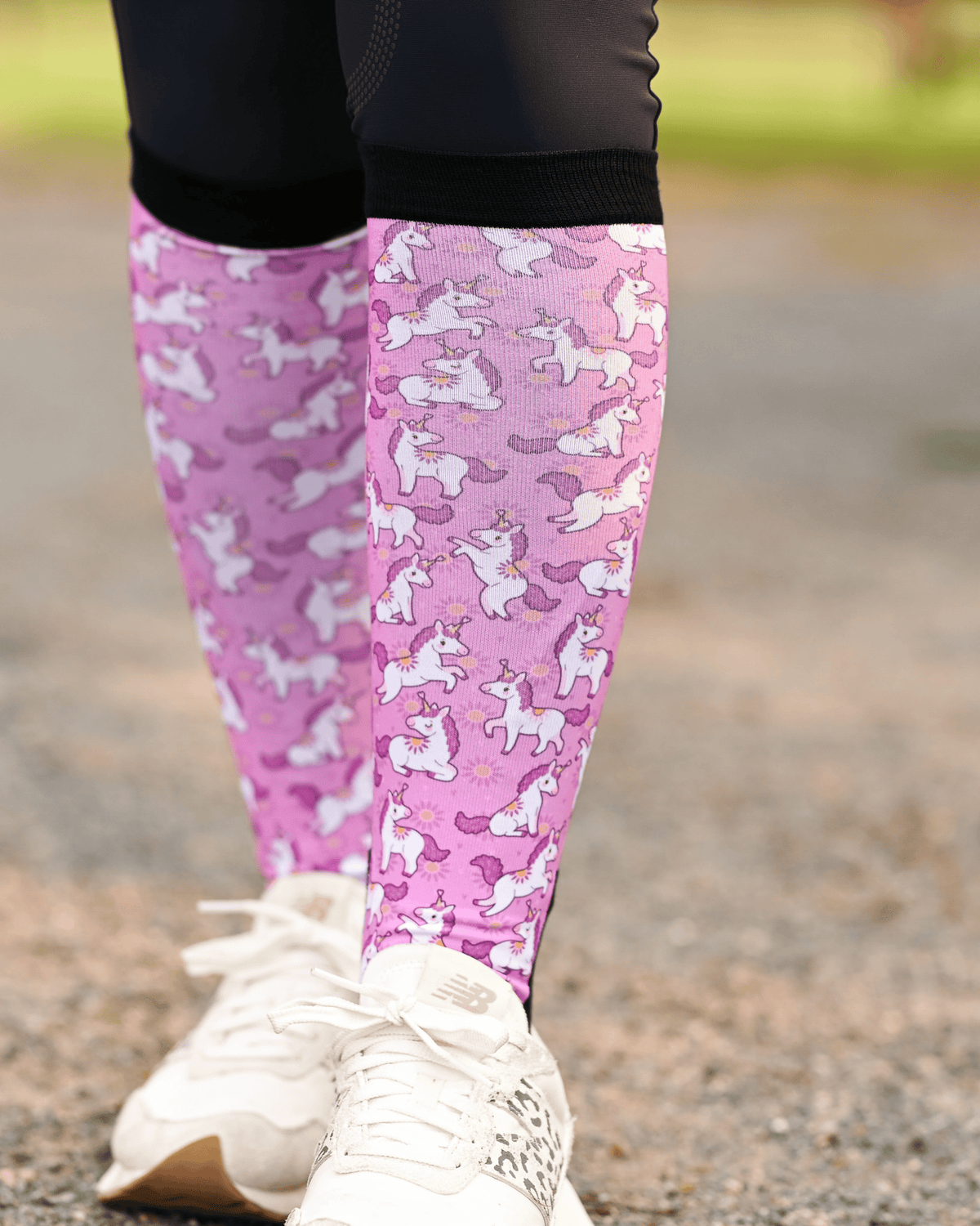 Sunshine and Unicorns Pair & a Spare boot socks worn on the calf, bright pink with white unicorns and yellow suns