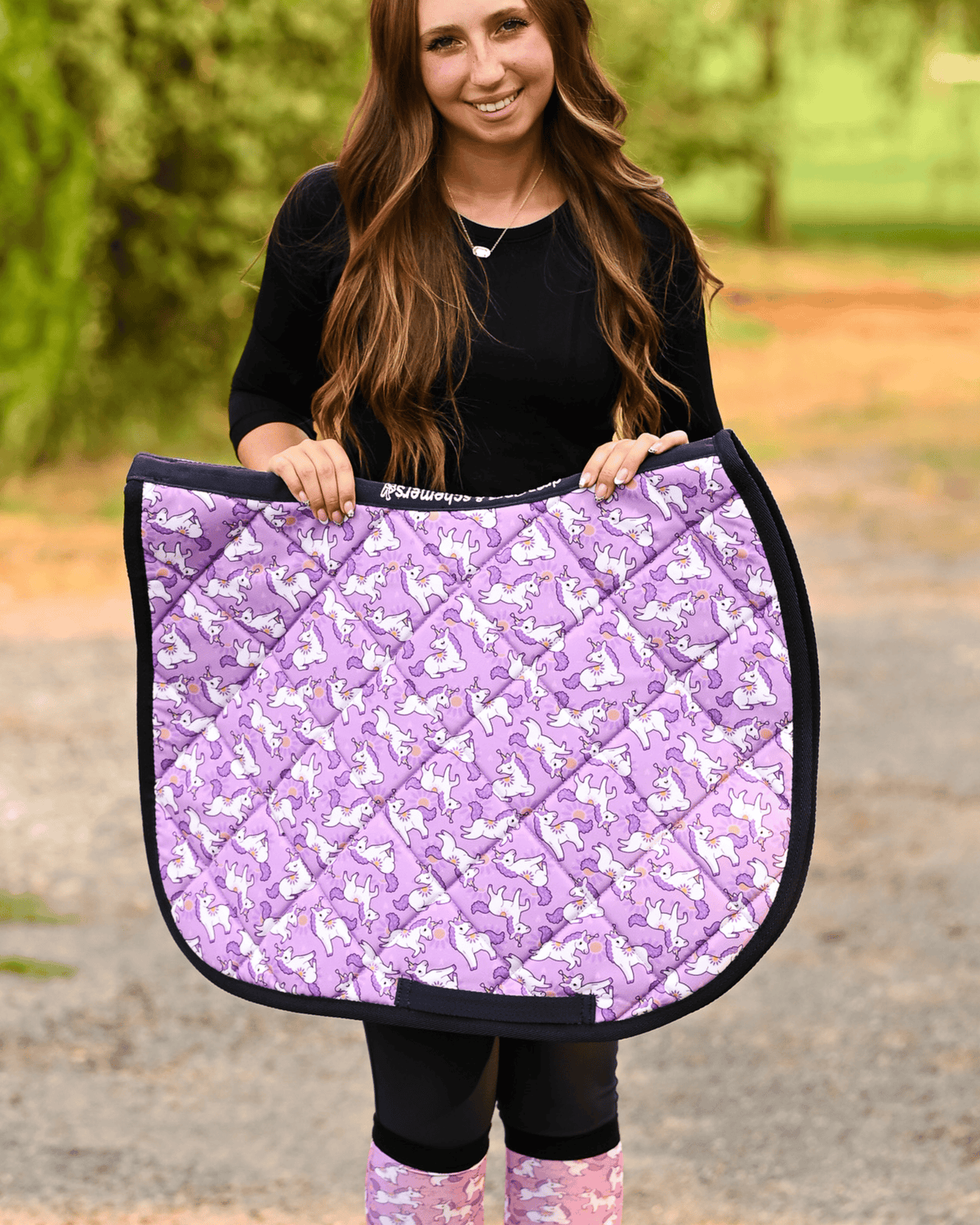 Sunshine & Unicorns all-purpose saddle pad in purple, printed with white unicorns and yellow suns