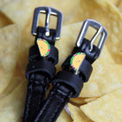 Black leather spur straps with stainless steel buckles and custom taco-themed charms