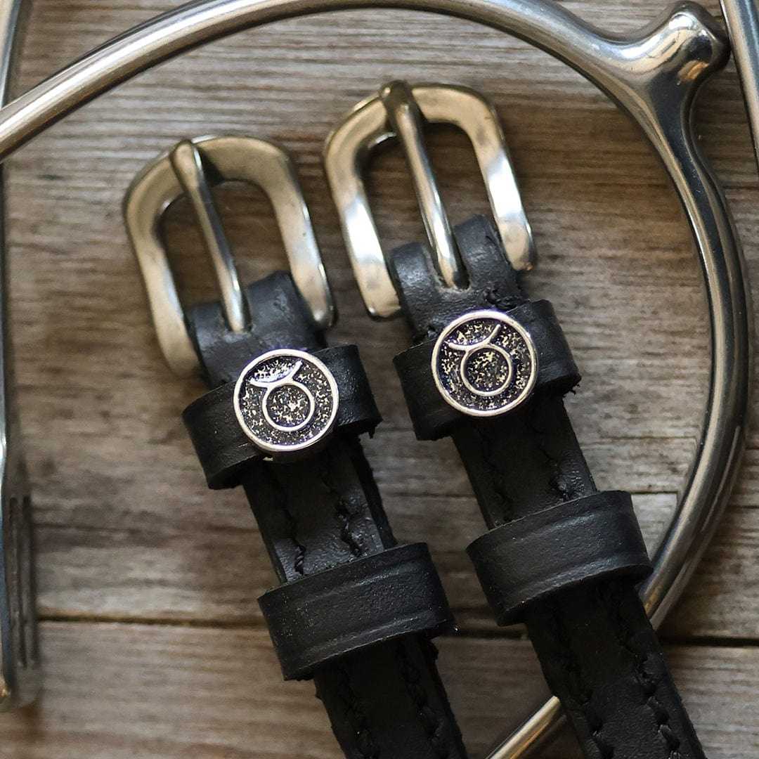 Black leather Taurus Spur Straps with stainless steel buckles and custom Taurus charms