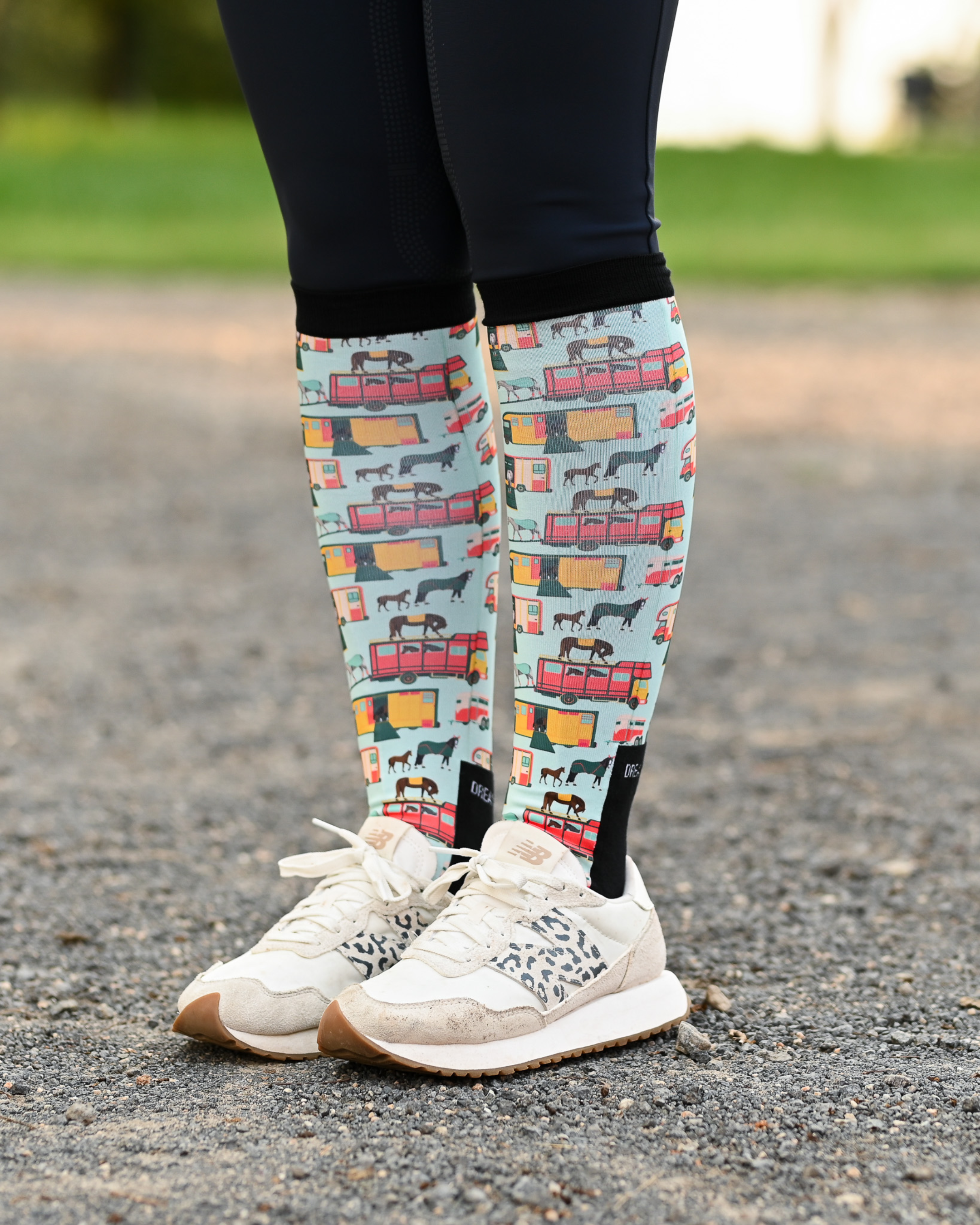 The Pony Island Retro Trailers riding boot socks styled over breeches, mint green with vintage horse trailers