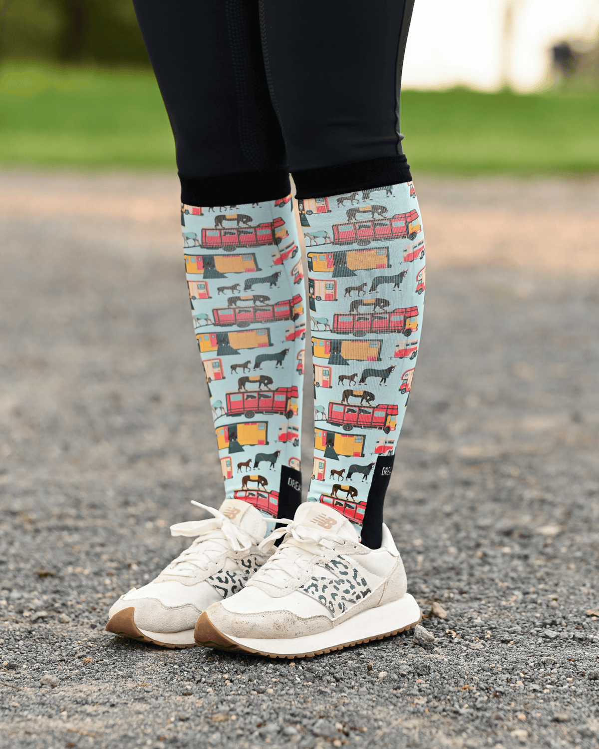 The Pony Island Retro Trailers riding boot socks styled over breeches, mint green with vintage horse trailers
