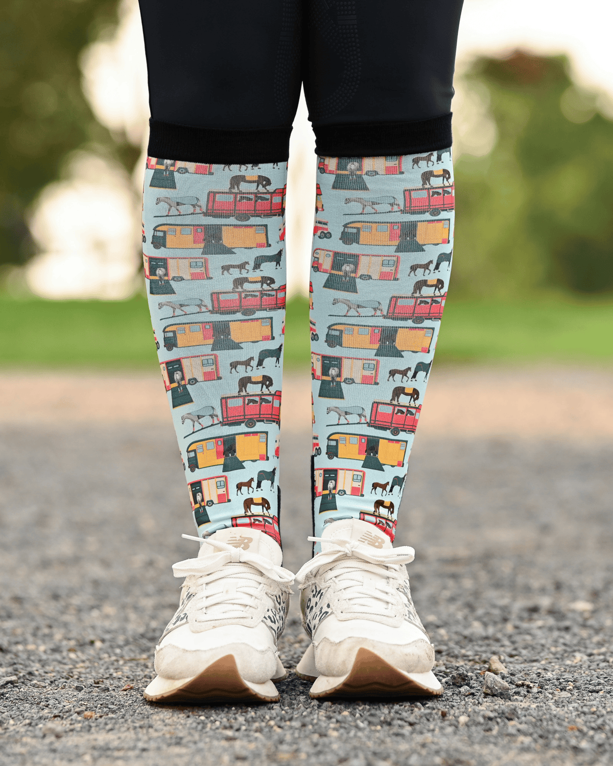 The Pony Island Retro Trailers equestrian boot socks worn at the barn, mint green with vintage horse trailers