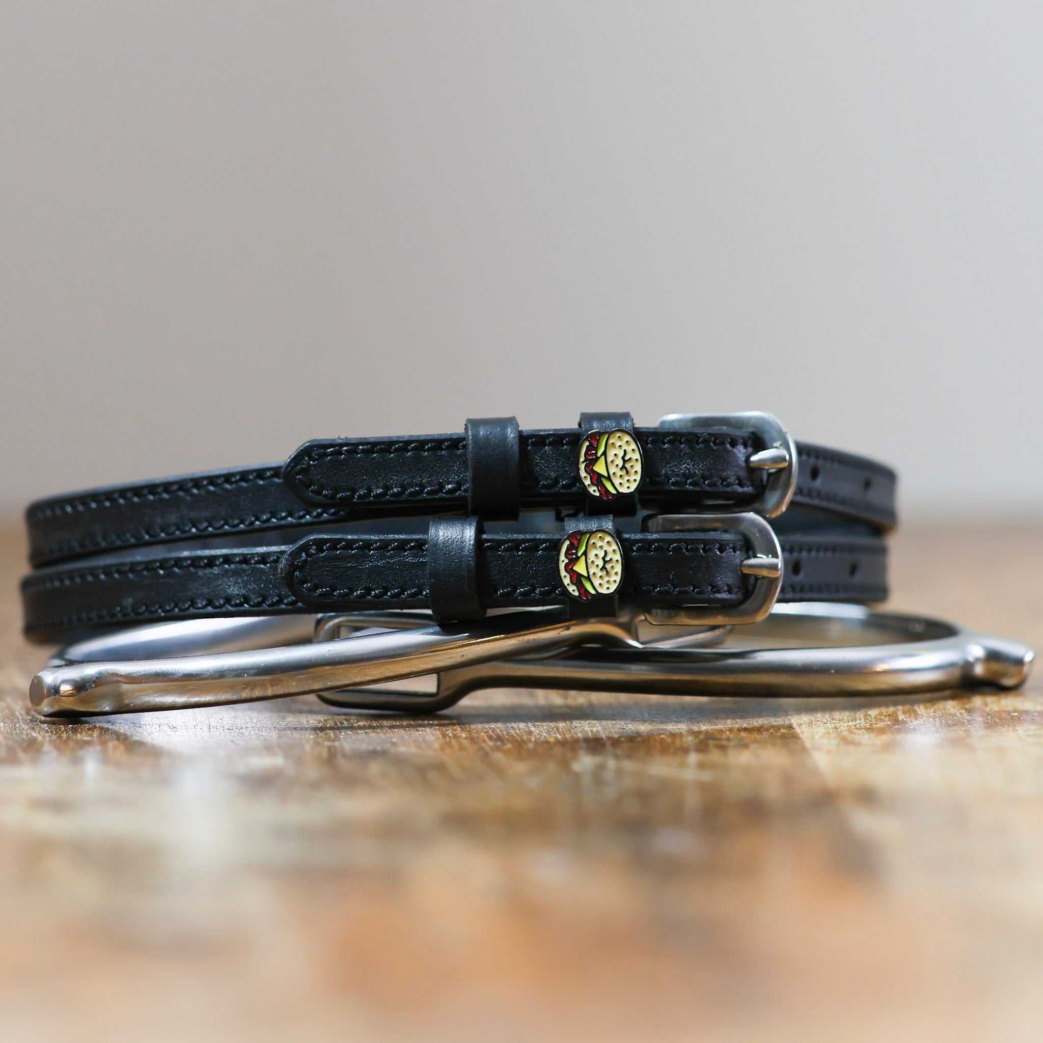 ManeJane Bagel Sandwich Spur Straps Spur Straps — black leather, non-stretch, hero image for English riders.