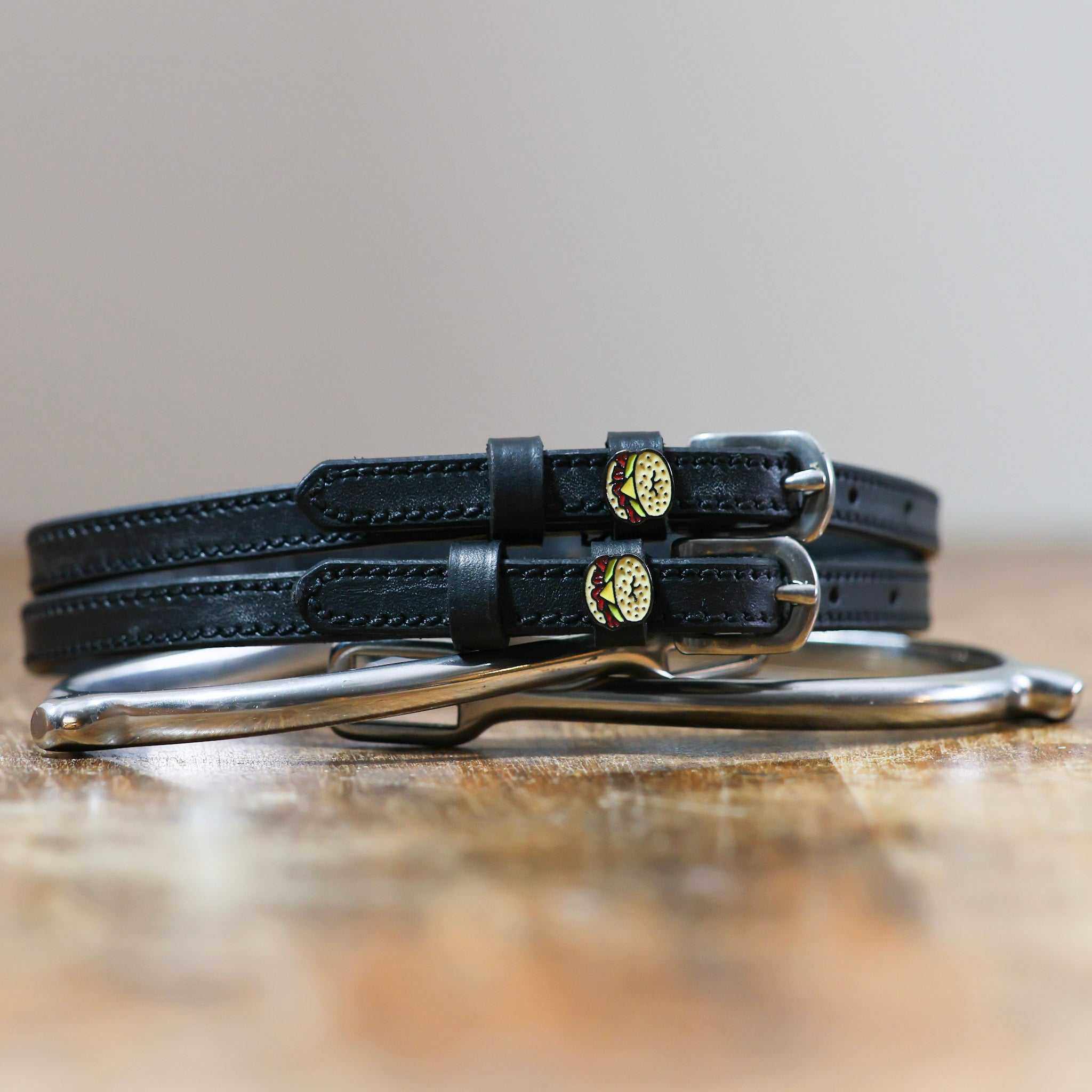 ManeJane Bagel Sandwich Spur Straps Spur Straps — black leather, non-stretch, hero image for English riders.