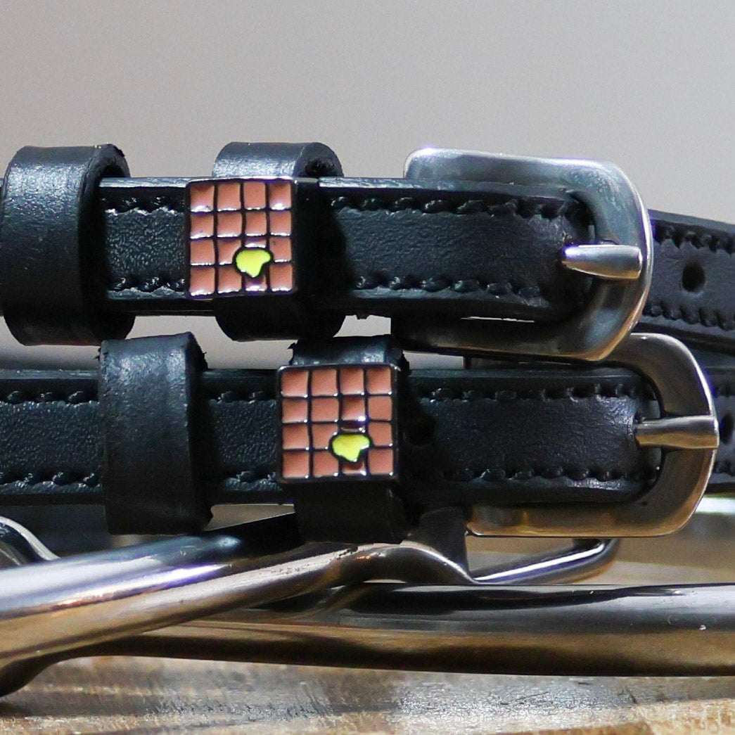 Black leather spur straps with stainless steel buckles and custom waffle charm by ManeJane