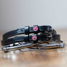 Black leather pink flower spur straps with stainless steel buckles and custom charm