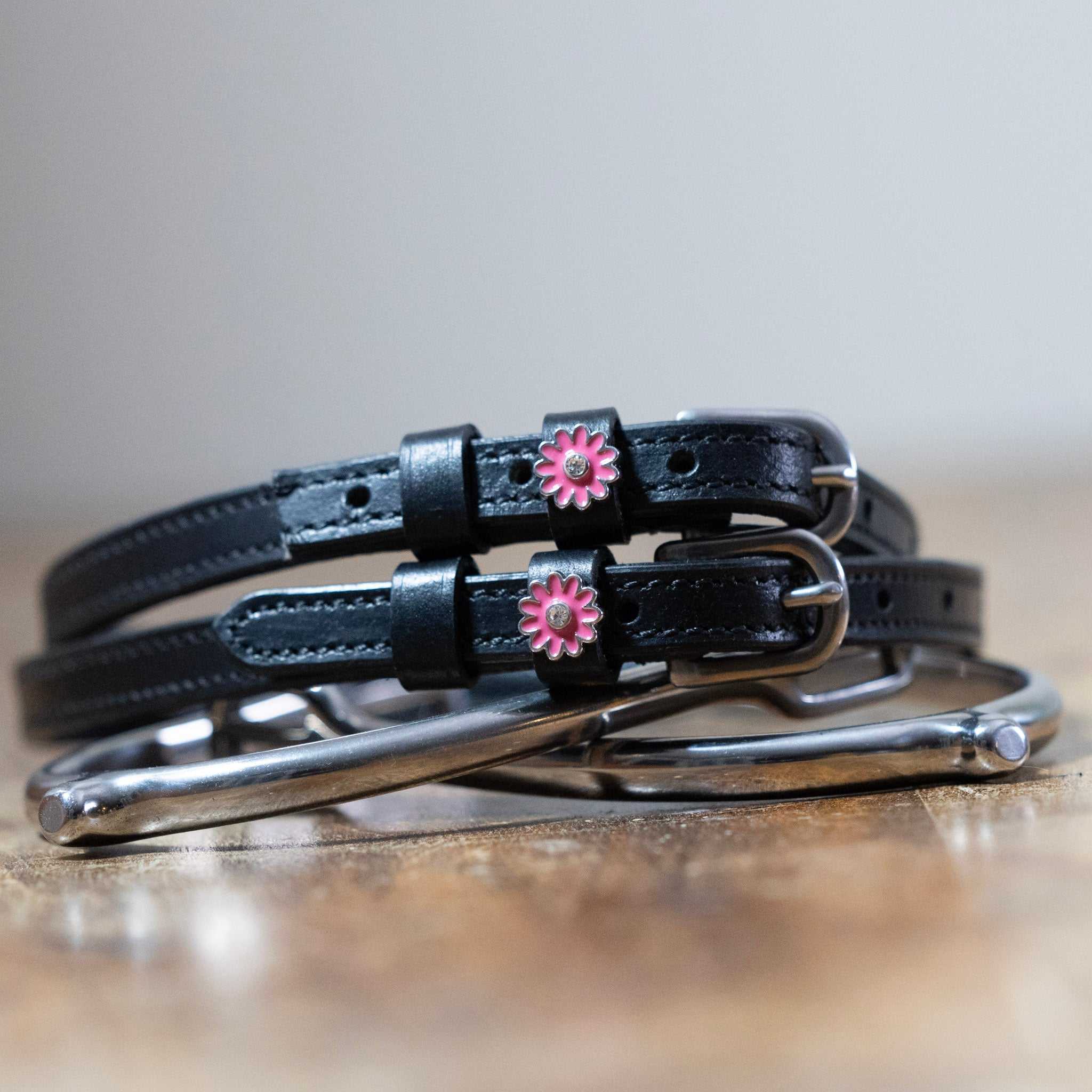 Black leather pink flower spur straps with stainless steel buckles and custom charm