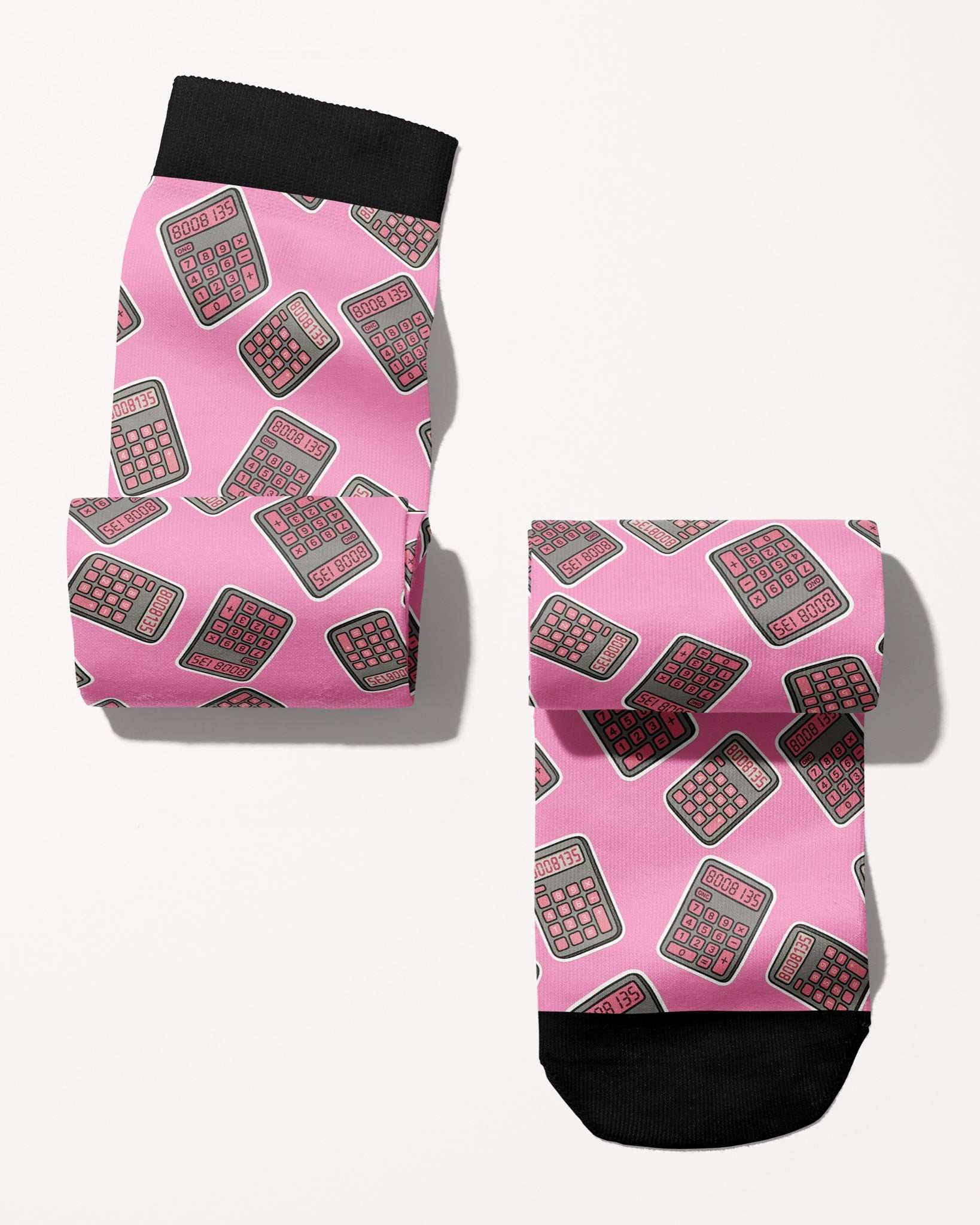 Boobies Limited Edition boot socks, calculator print on pink, rolled, showing the pattern repeat, by Dreamers & Schemers