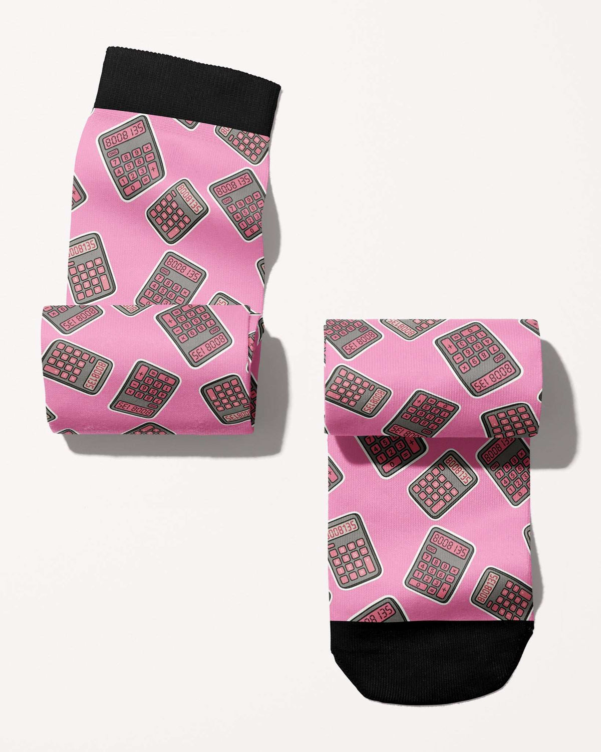 Boobies Limited Edition boot socks, calculator print on pink, rolled, showing the pattern repeat, by Dreamers & Schemers