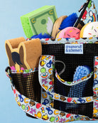 Feeling Stable grooming tote filled with grooming supplies, woven dreamers & schemers label in view