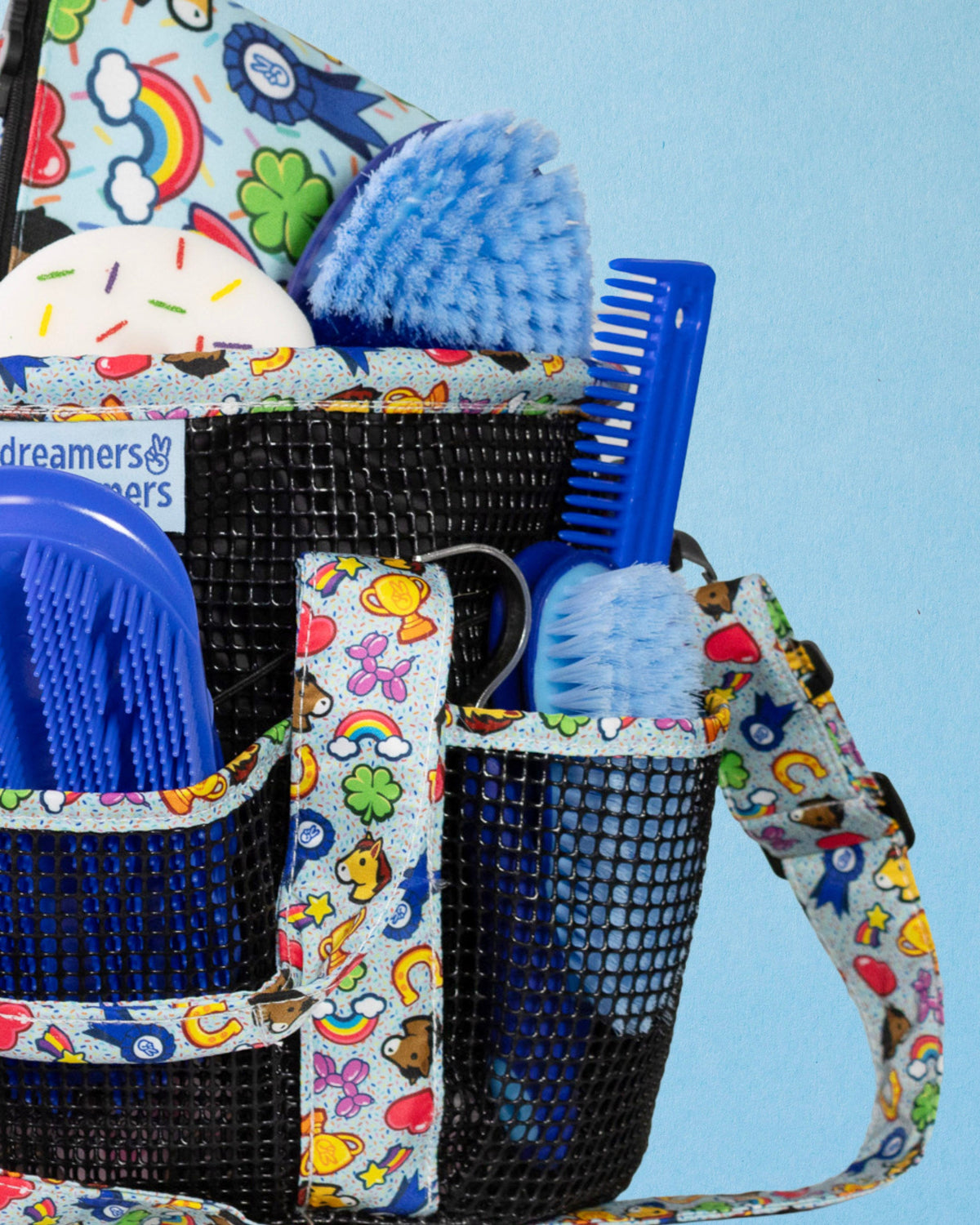 Feeling Stable grooming tote from the side, showing the removable shoulder strap and mesh pockets