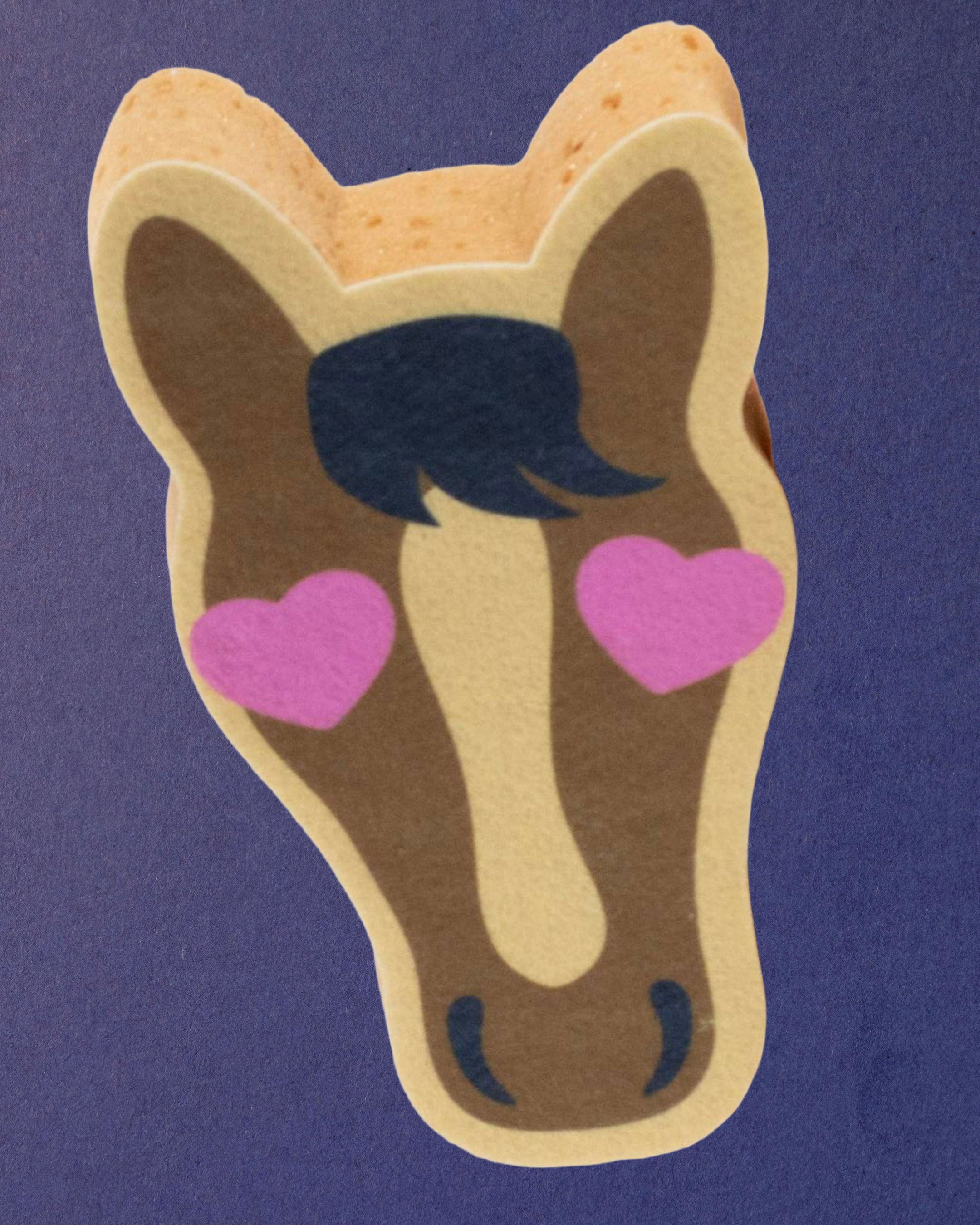 Pony Love expanding bath sponge at an angle so the sponge thickness and textured edge show