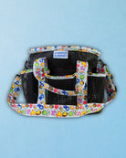 Feeling Stable grooming tote shown empty, with its six exterior pockets and pull-up top closure