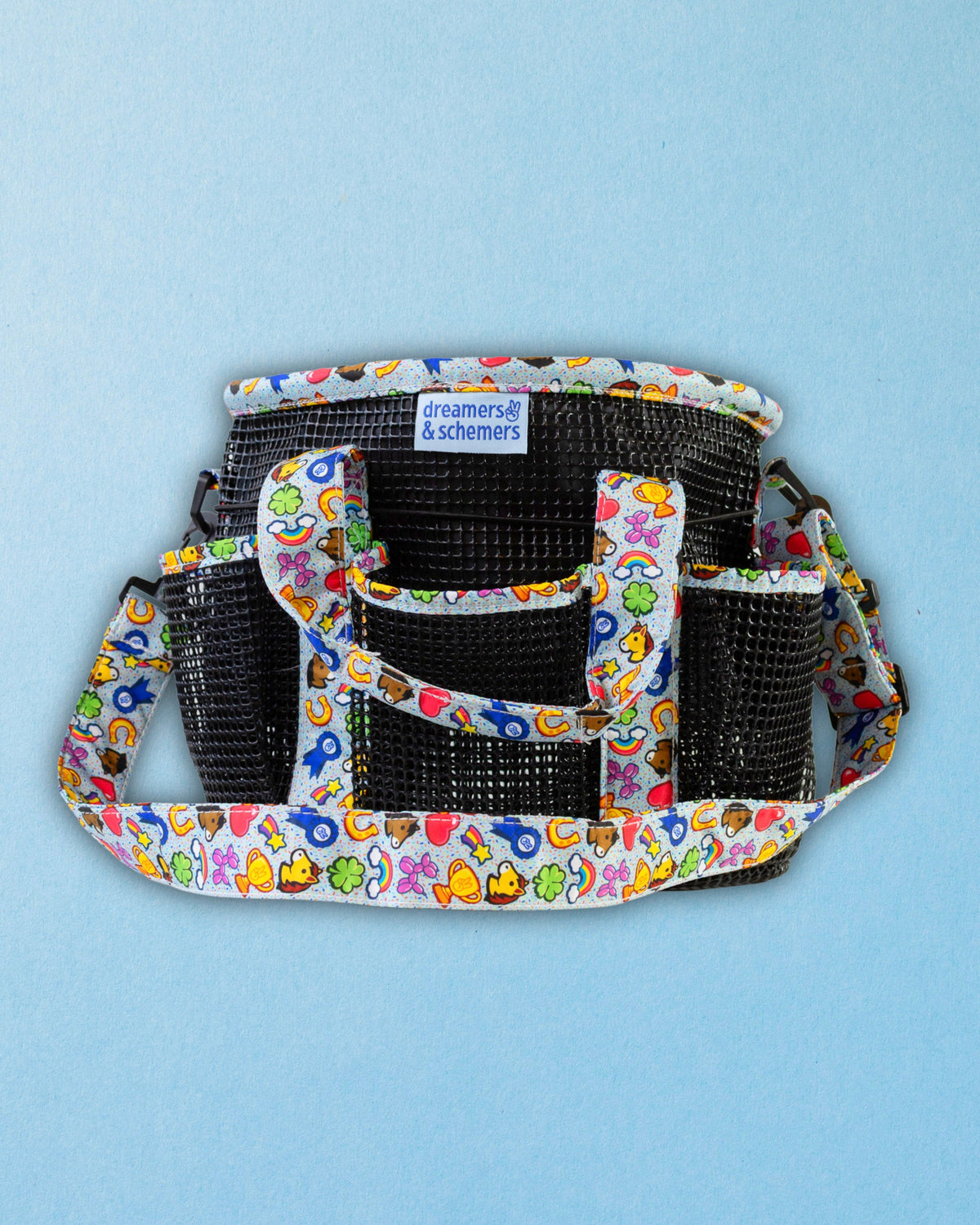 Feeling Stable grooming tote shown empty, with its six exterior pockets and pull-up top closure