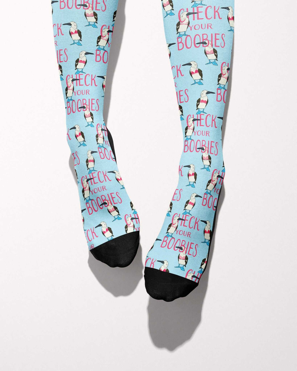 Check Your Boobies Limited Edition boot socks, blue-footed boobies and pink lettering on sky blue, worn, showing the full-length pattern, by Dreamers & Schemers